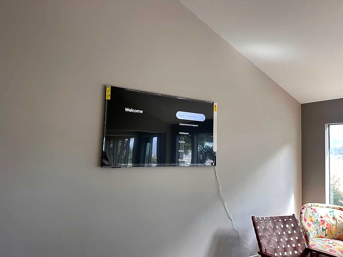 Television mounted on a living room wall